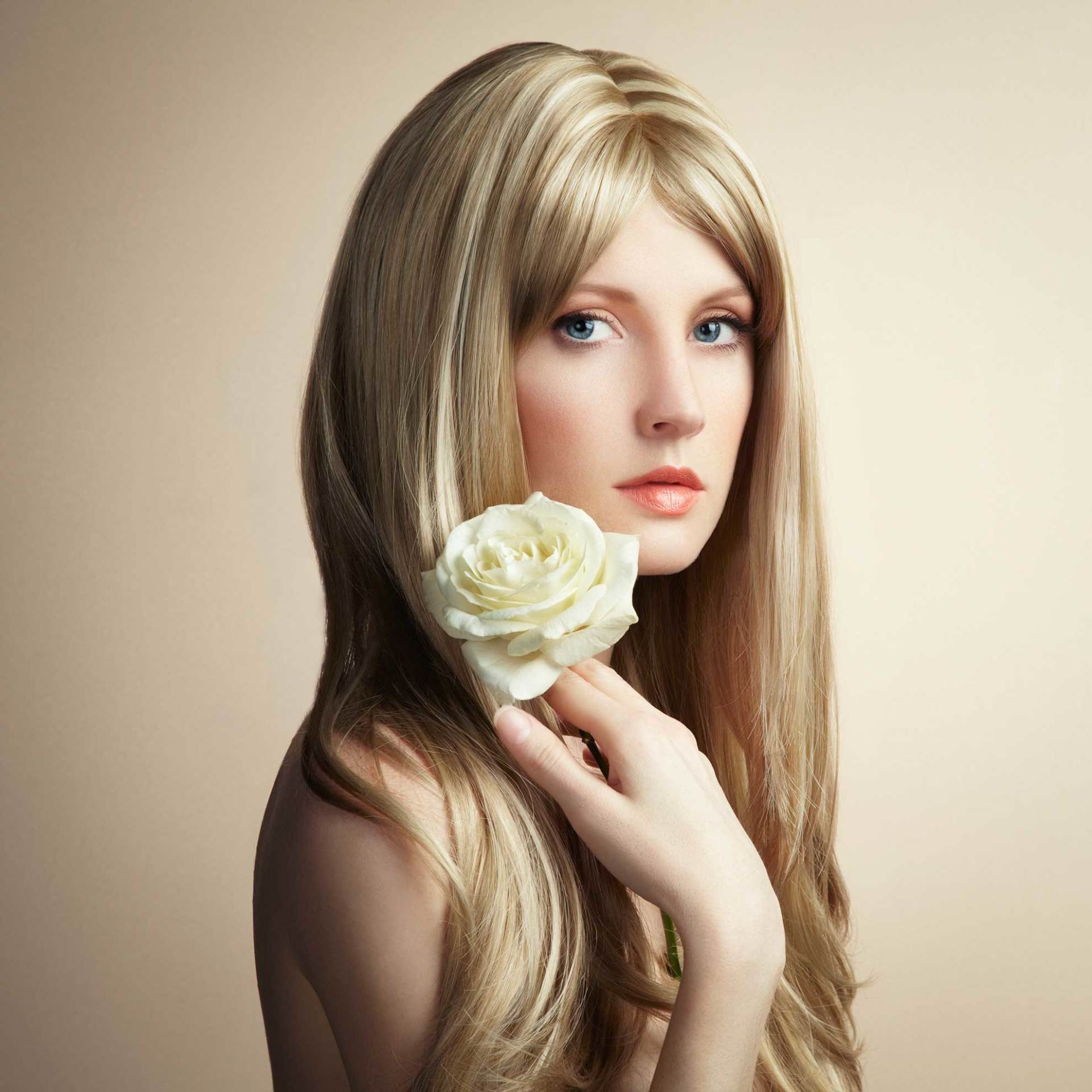 Women with long hair holding a flower